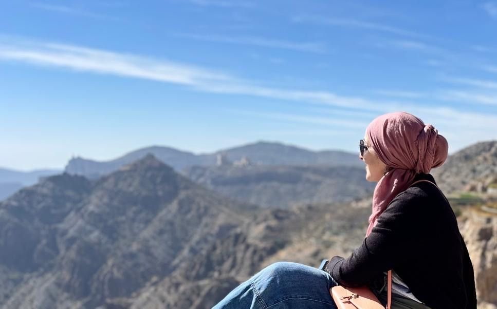 Dr. Salma Waly looking out over mountains